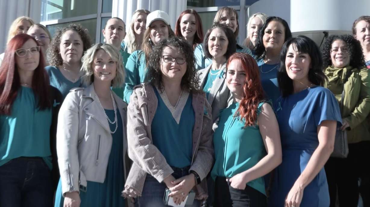 Women who claim they were abused by a Provo OB-GYN pose for a photo for reporters on the steps of t...