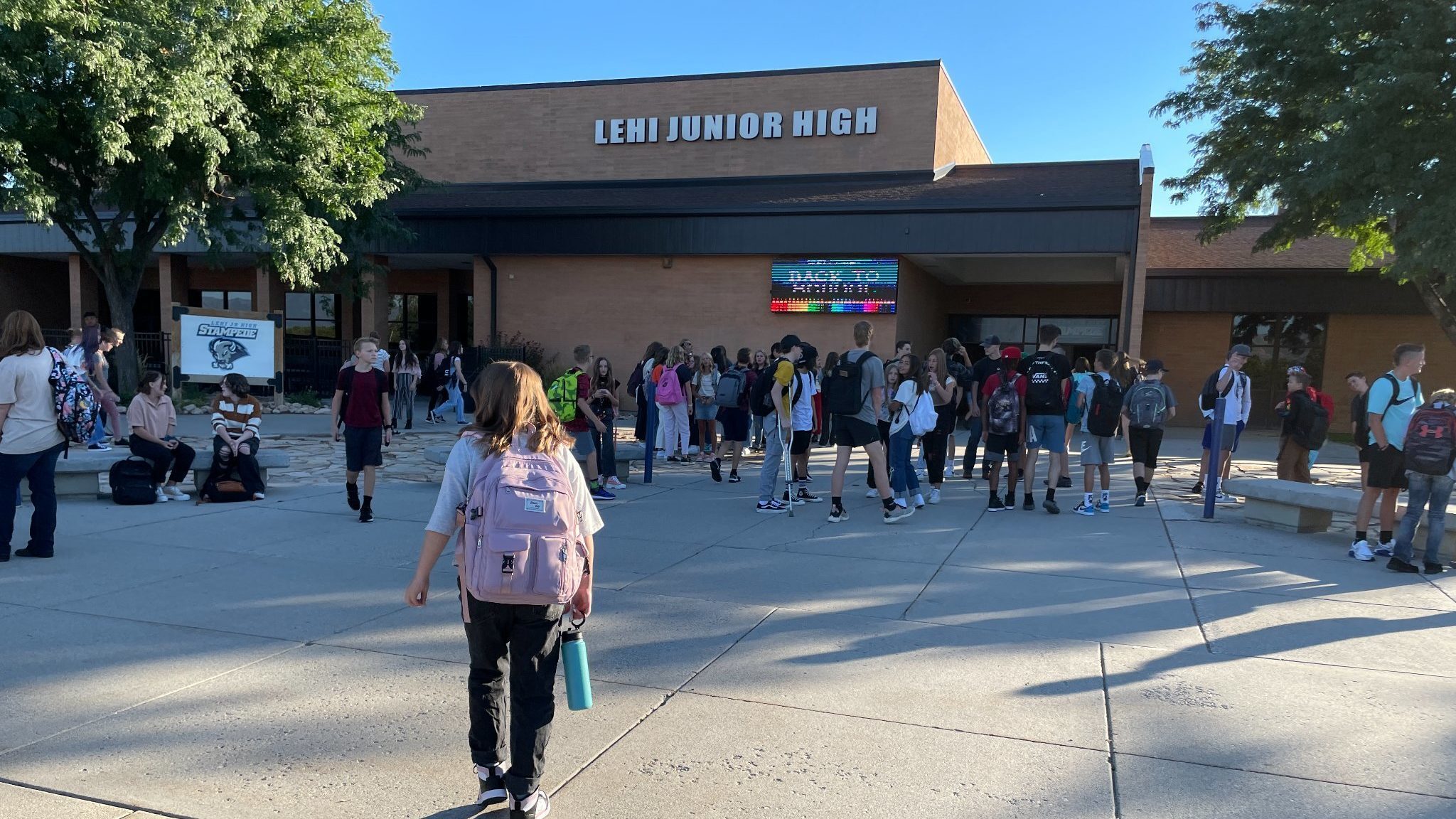 utah students walk outside of Lehi Junior High...