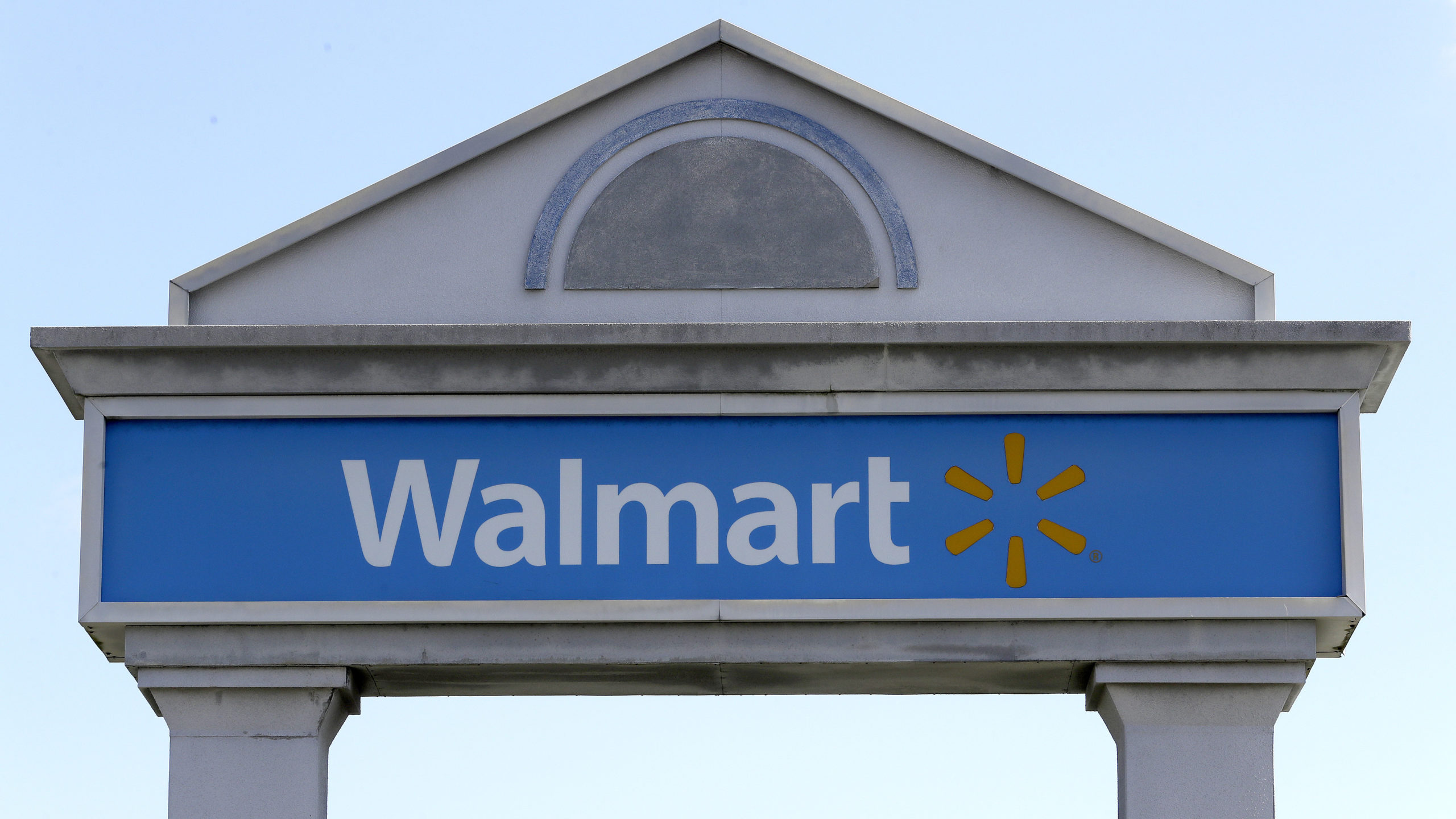 walmart store sign covered, walmart hiring people without college degrees for high-paying positions...