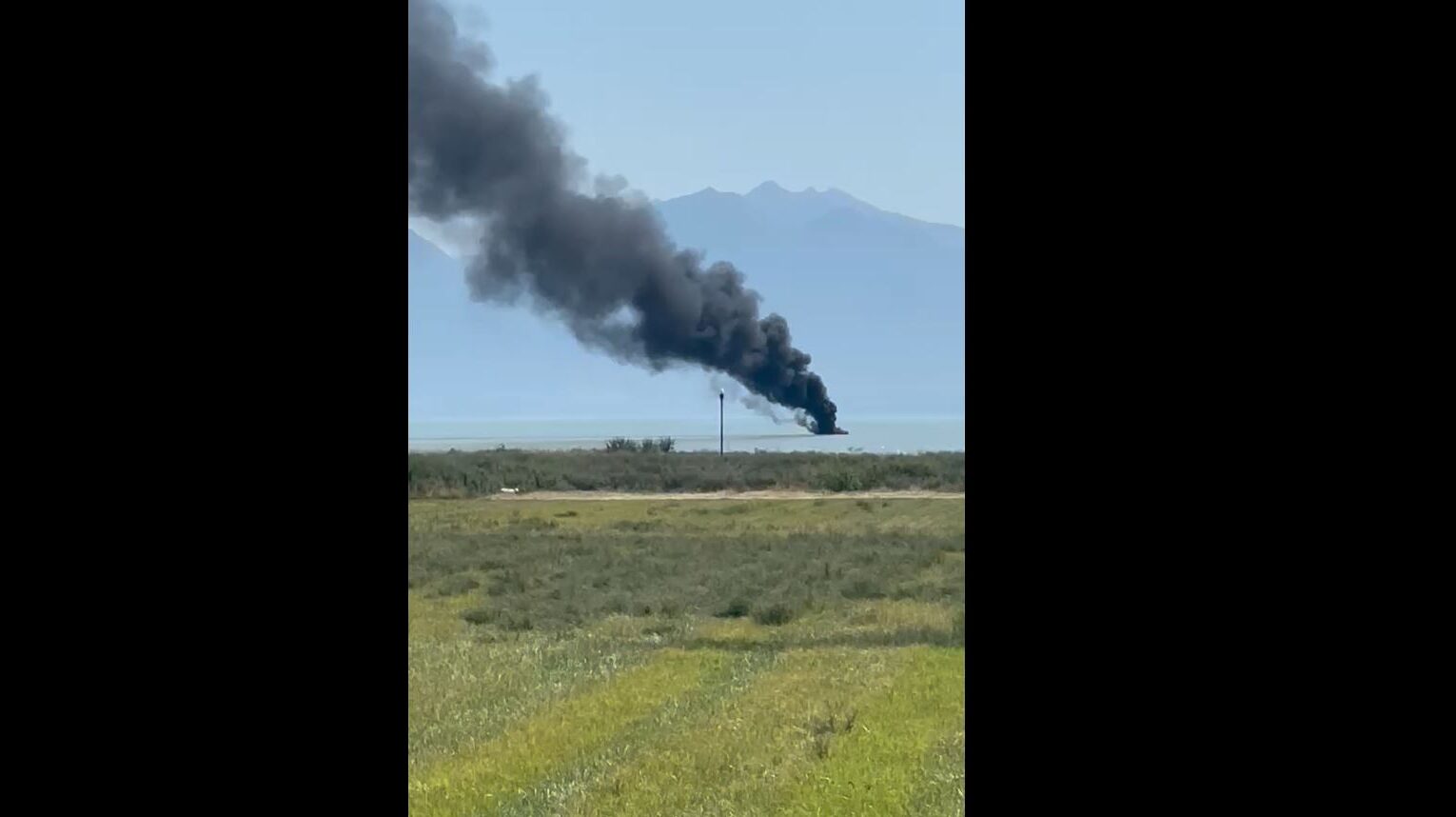 A view of the boat on fire on Utah Lake....