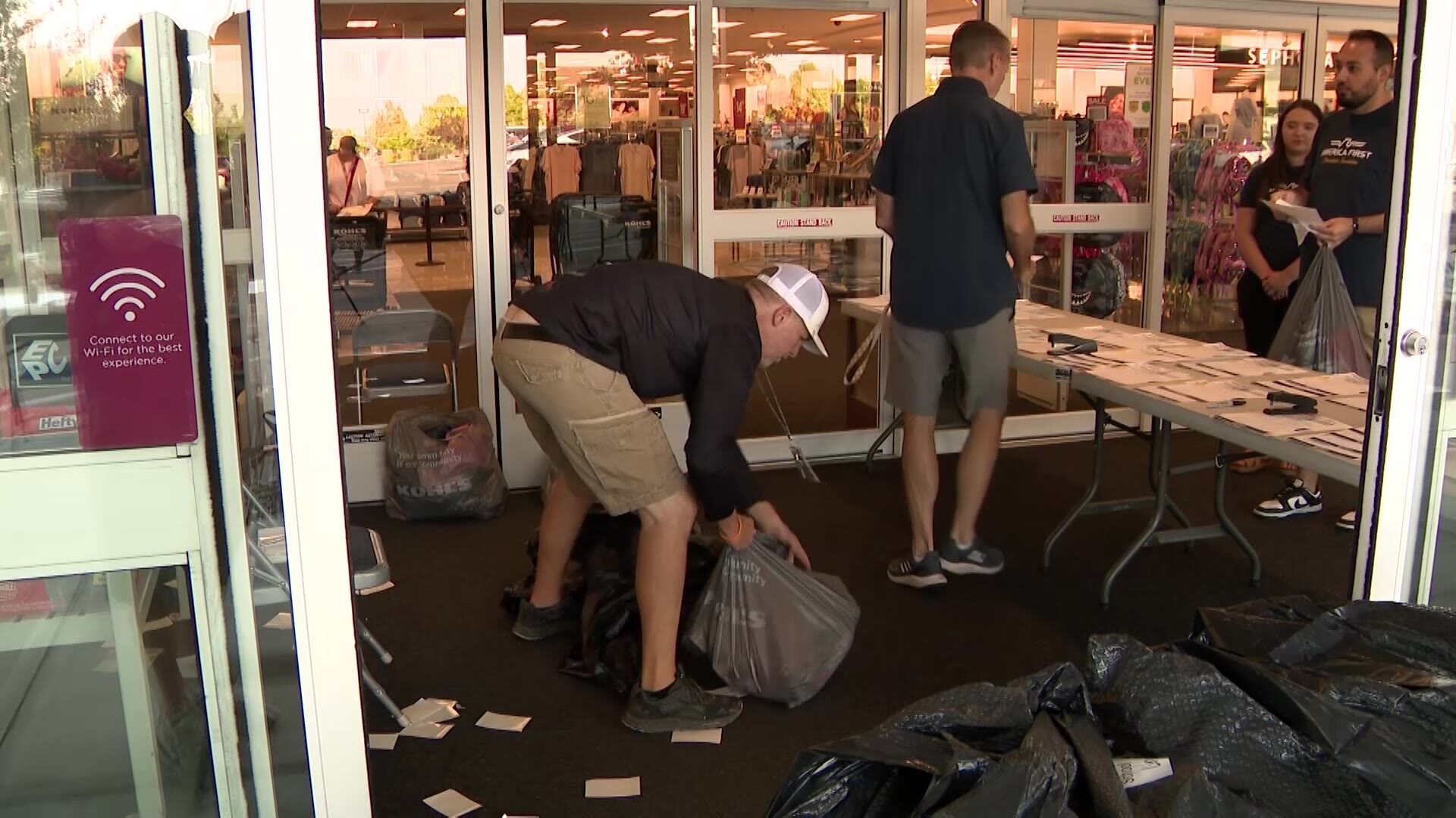 Volunteers in Davis County gathering the clothing they bought for students....