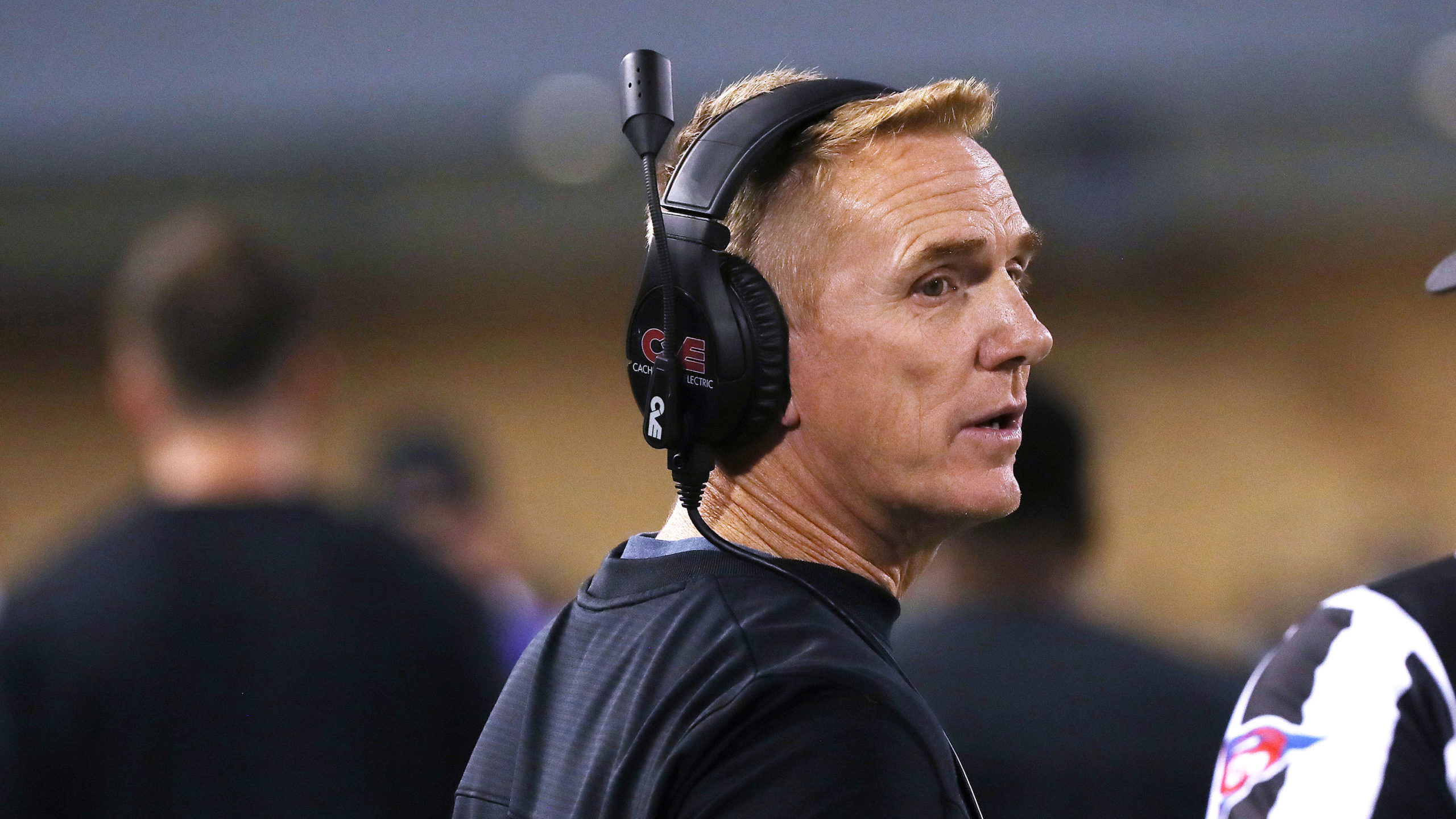 Utah State University football coach Blake Anderson talks with a referee during a game in Logan on ...