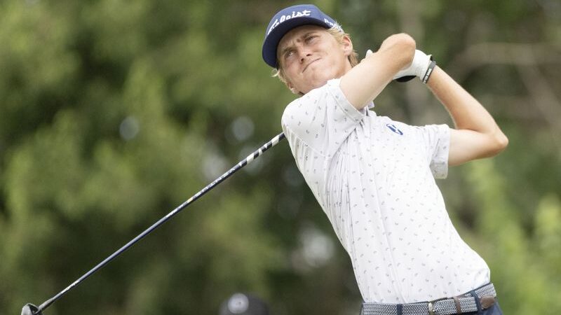 Cooper Jones, a BYU golfer, swings his club in the Korn Ferry Tour Utah Championship....