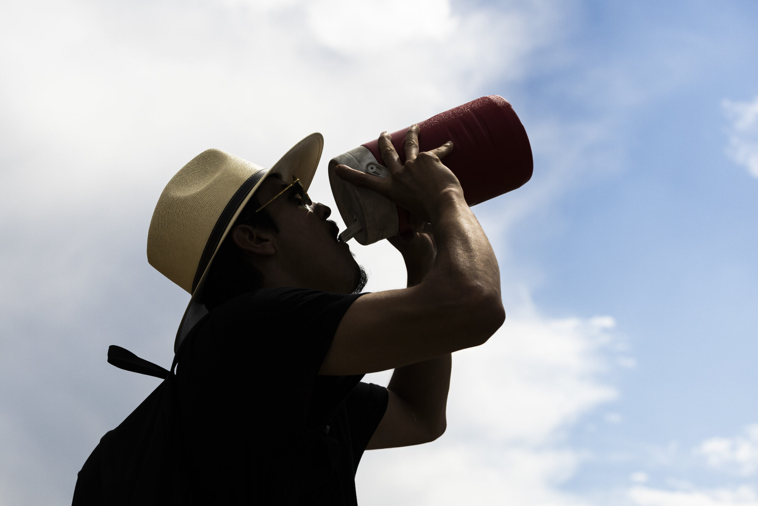 A hiker drinks water near the Potato Hill Trailhead of Corner Canyon in Draper on Thursday, July 18...