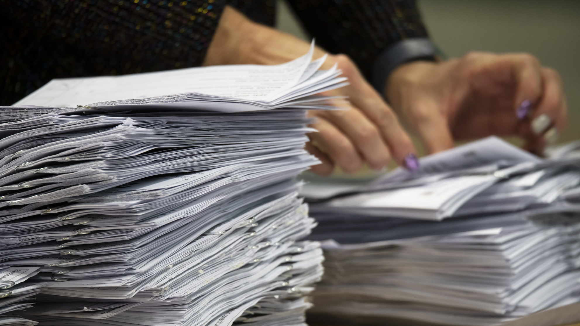 Generic image of signature counting. The man hired by Bruce Hough's campaign to gather signatures f...