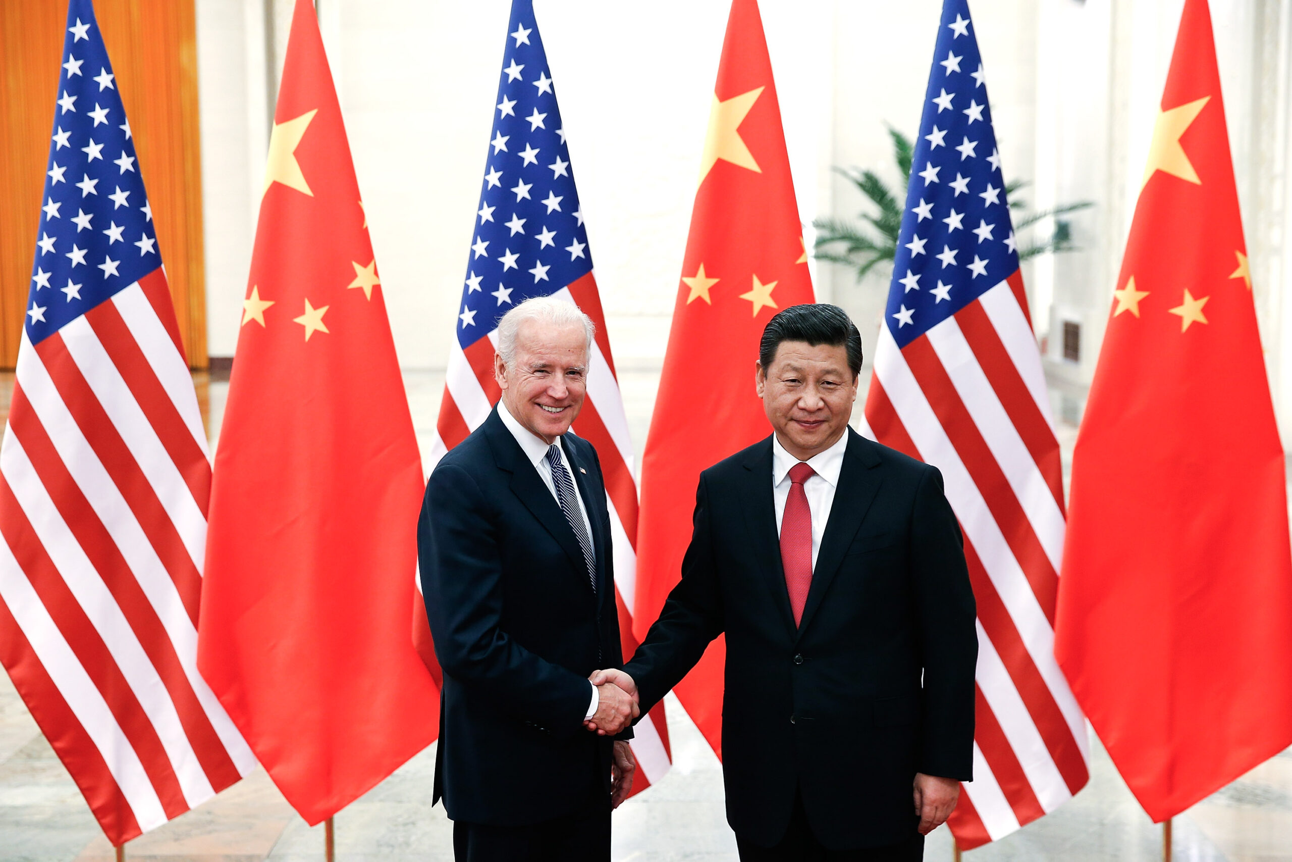 BEIJING, CHINA - DECEMBER 04: Chinese President Xi Jinping (R) shake hands with U.S Vice President ...