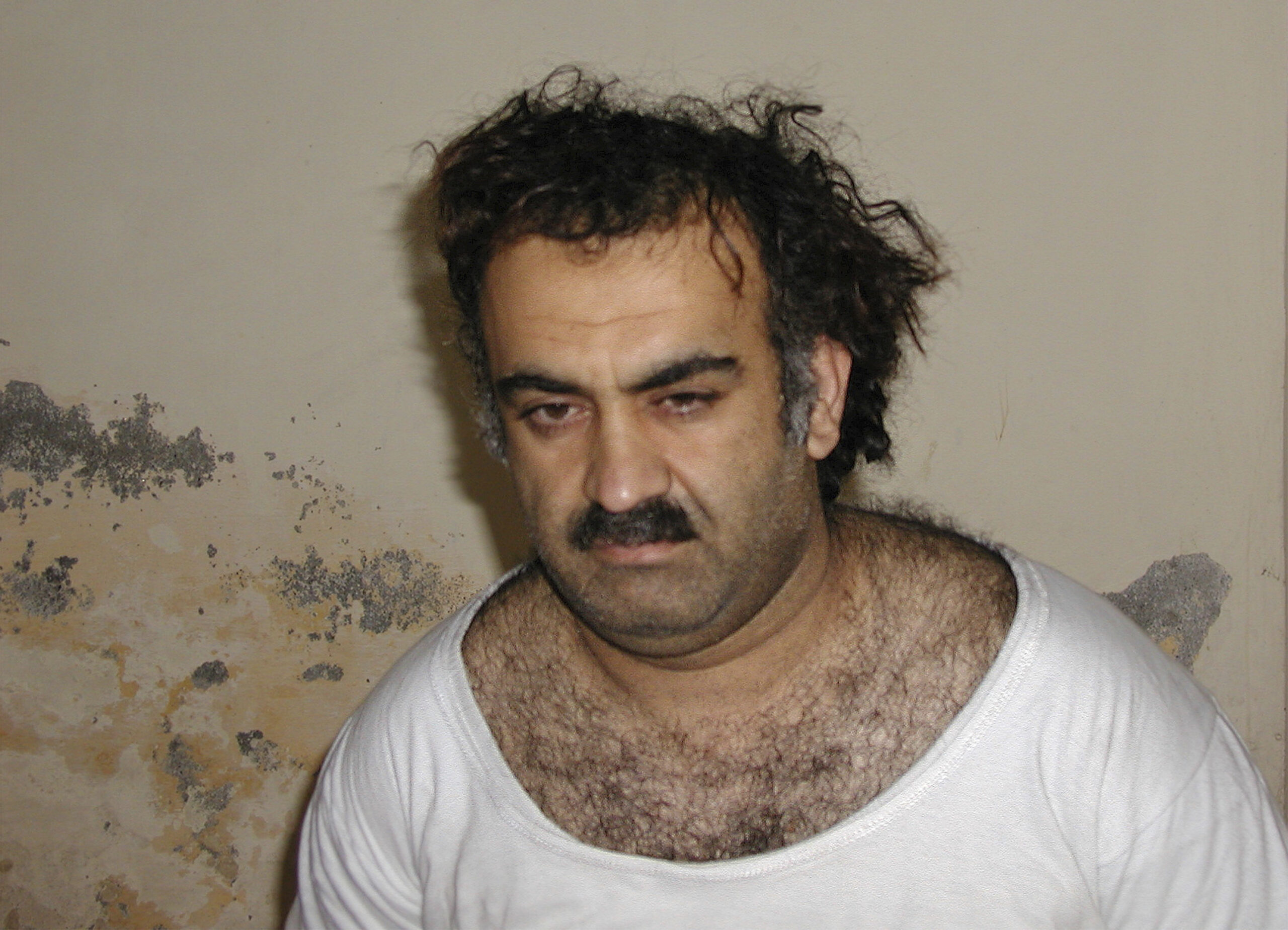 FILE- Khalid Sheikh Mohammed, the alleged Sept. 11 mastermind, is seen shortly after his capture du...