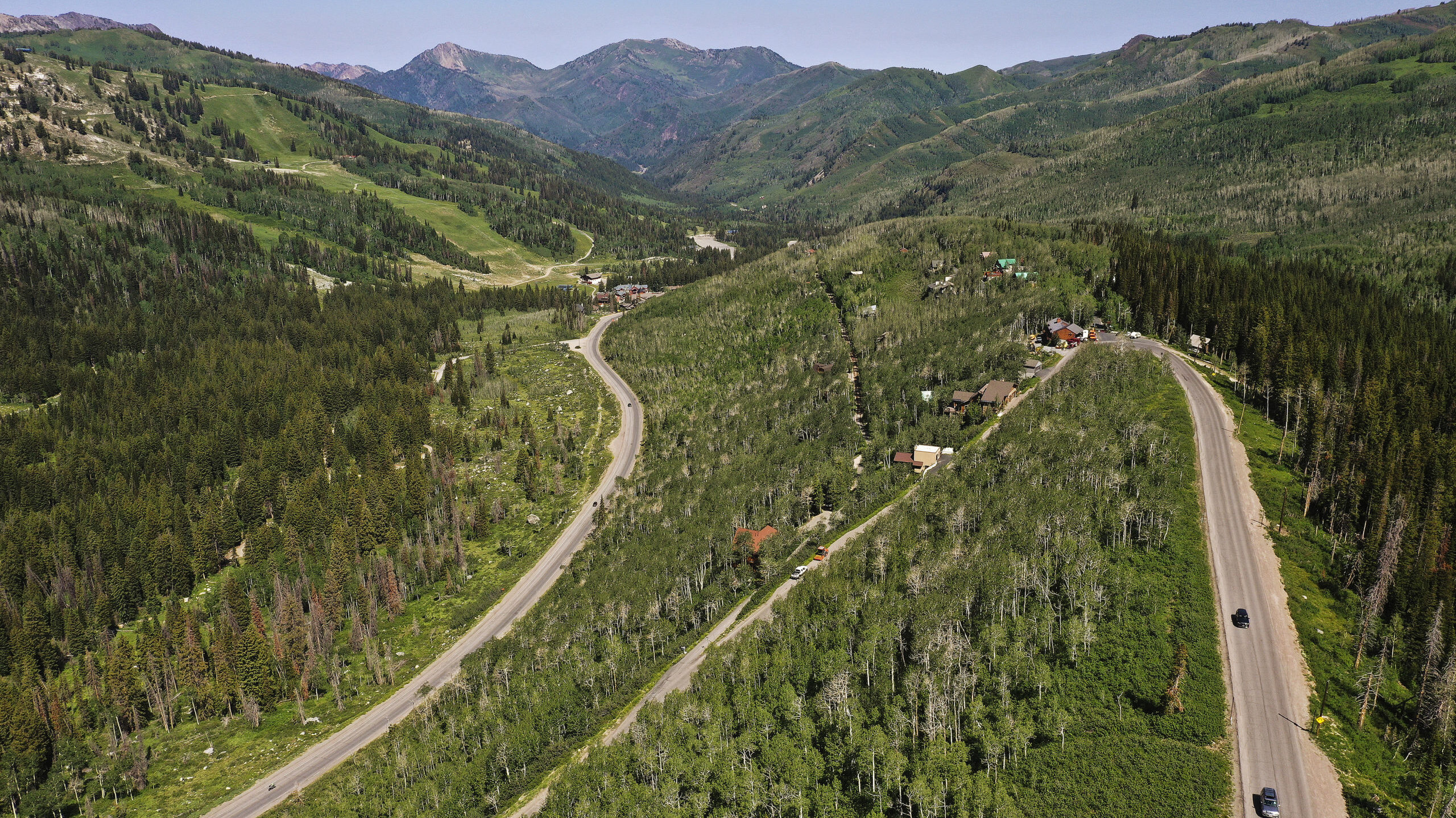 cars drive along guardsman pass...