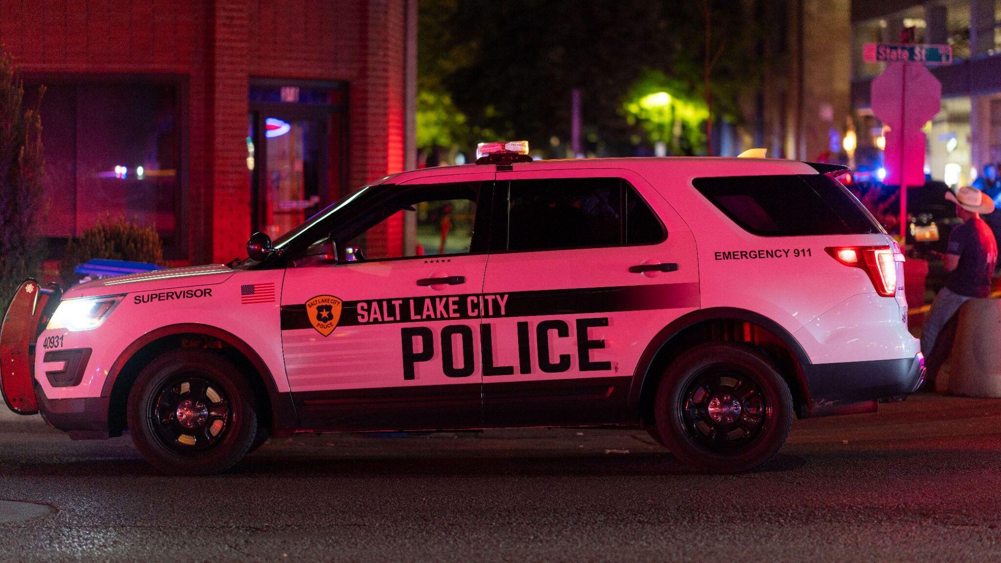 A Salt Lake City Police SUV parked near 355 South State Street as officers investigate a shooting i...