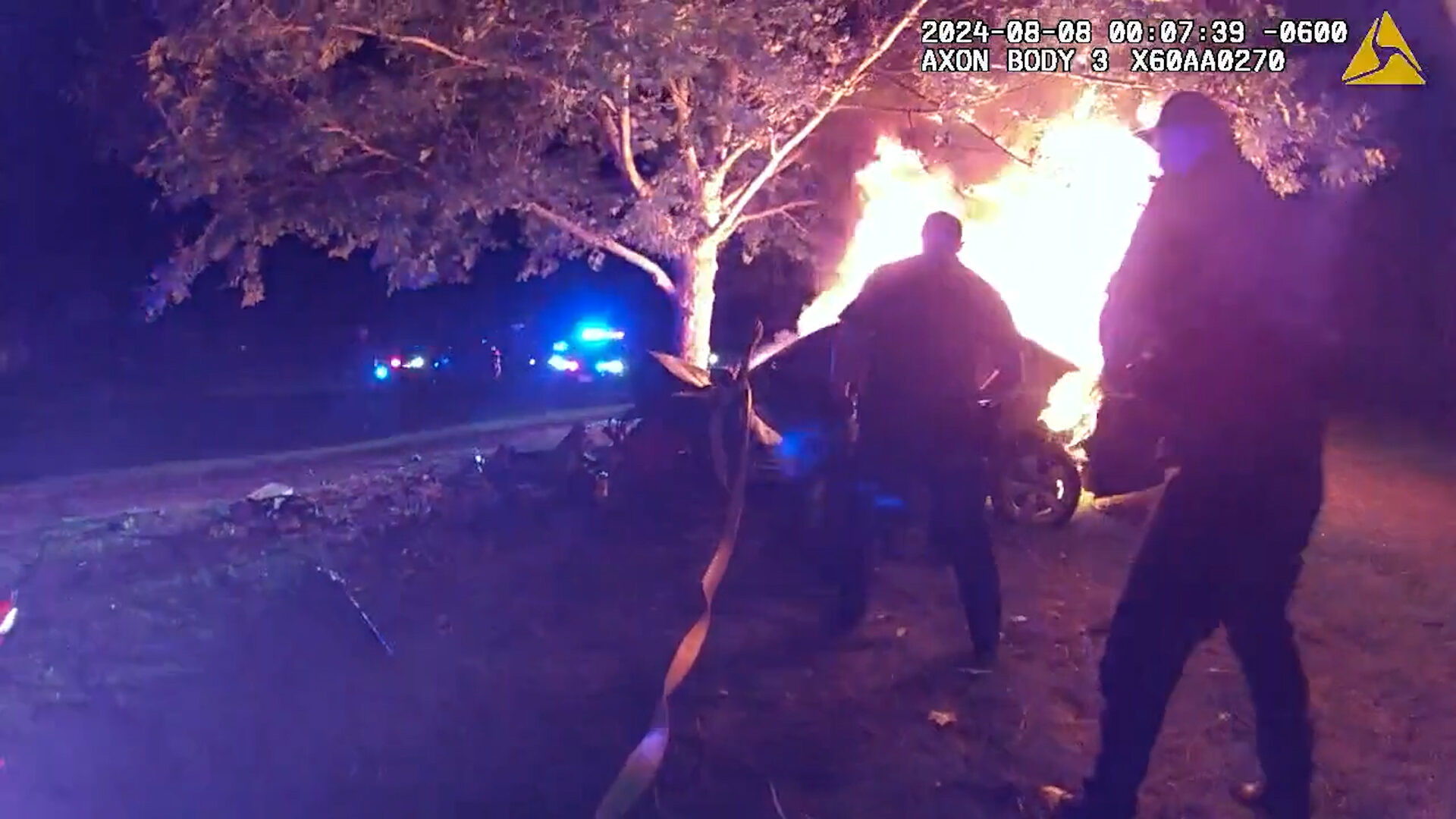 Officers pulling a teenager out of a burning car on Aug. 08, 2024. (American Fork Police Department...