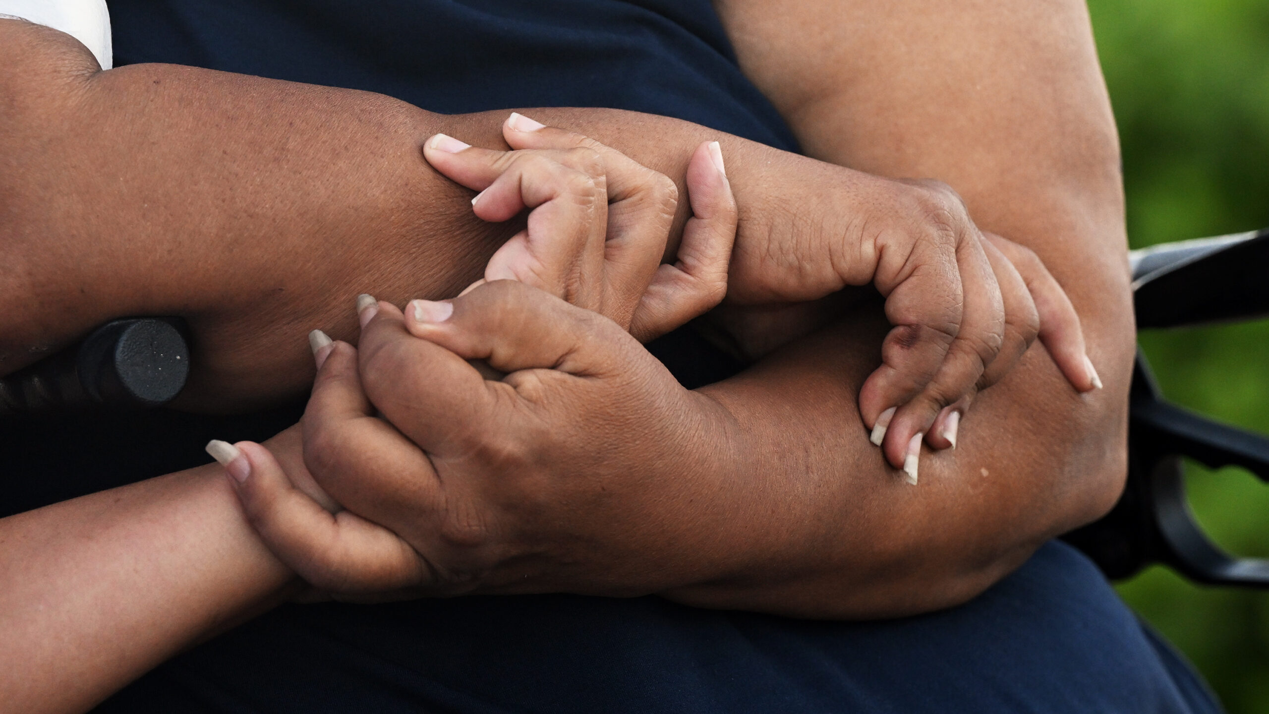 FILE: Lani Williams and her mother, Noni Mirkovich, hold hands as they give an interview on Thursda...