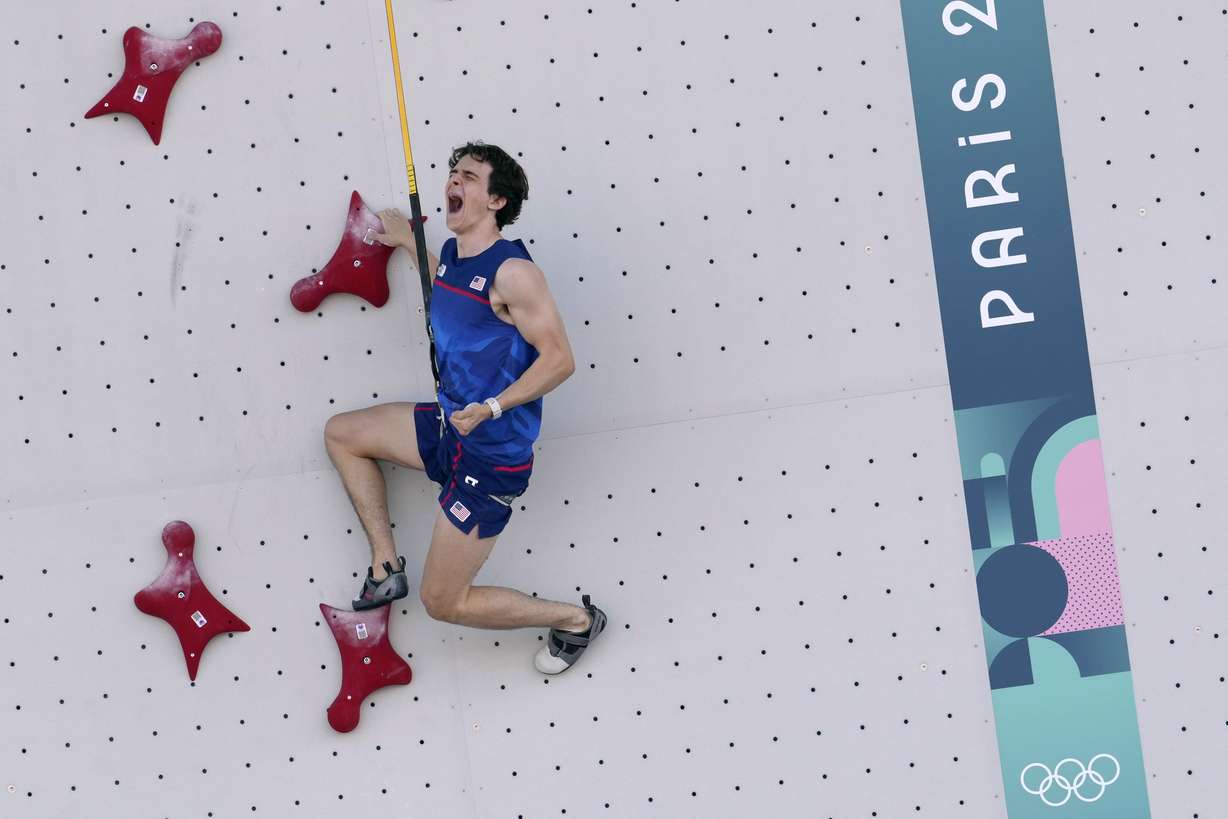 Sam Watson on a climbing wall during the 2024 Summer Olympics...