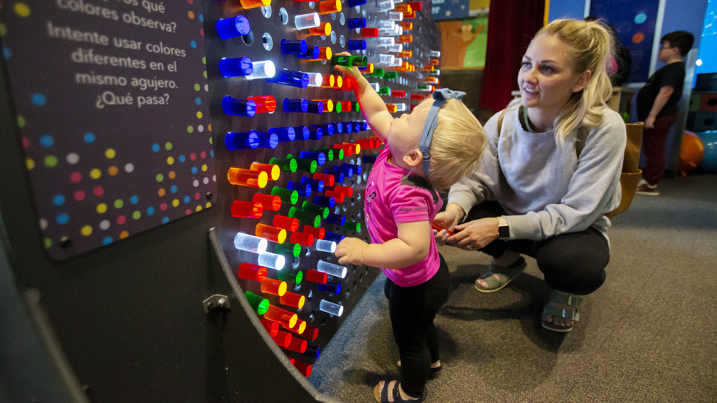 a toddler and her mom at discovery gateway, which is one of many organizations with summer camps in...