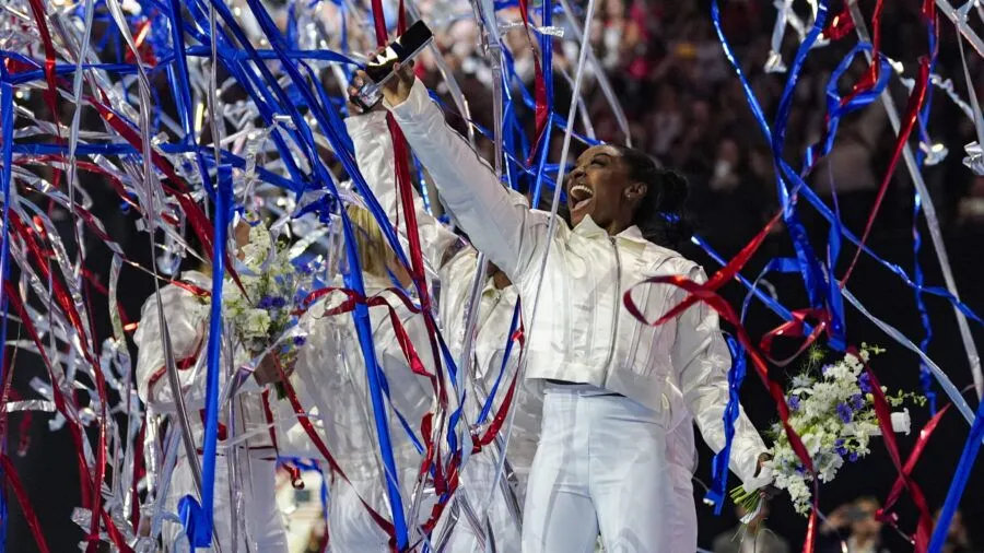 FILE - Simone Biles and the U.S. women celebrate as the 2024 team is named at the United States Gym...